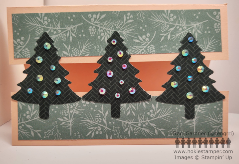Pink Christmas Card with three pine trees across the middle, each decoarated with rhinestones