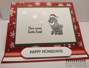 Christmas card featuring a poodle with a Santa hat and beard. The sentiment reads Here comes Santa Paws! At the bottom, the card is tucked behind a raised sentiment that says Happy Howlidays, so it stand as an easel.