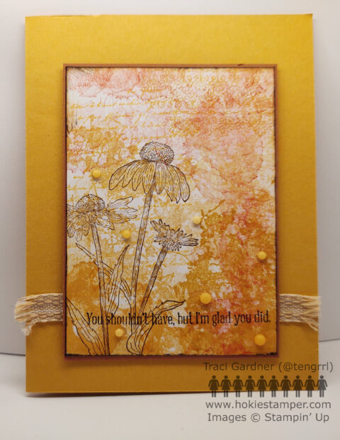 Mustard colored card with a collage of splatters, text, and flowers in shades of yellow and orange, with the sentiment, You shouldn't have, but I'm glad you did