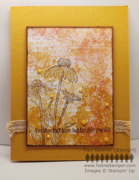 Mustard colored card with a collage of splatters, text, and flowers in shades of yellow and orange, with the sentiment, You shouldn't have, but I'm glad you did