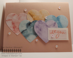 Pink Valentine's Day card with five hearts in different colors and the sentiment I [symbol for heart] you