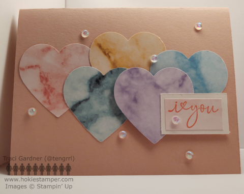 Pink Valentine's Day card with five hearts in different colors and the sentiment I [symbol for heart] you