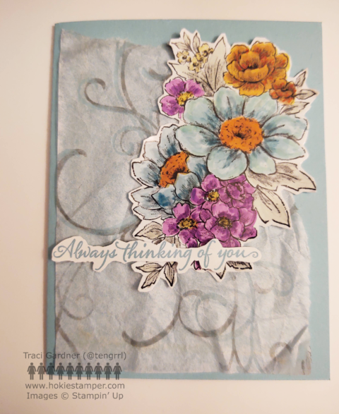 Light blue card with gray swirls in the background and a bunch of flowers in blue, purple, orange, and yellows, with the sentiment Always Thinking of You