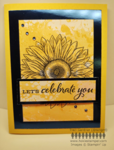 Yellow card with blue foil, featuring a large sunflower and the sentiment Let's celebrate you