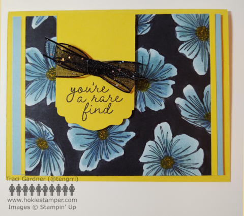 Greeting card with blue flowers on a black background with the sentiment, You're a rare find