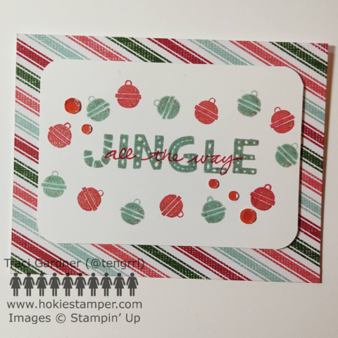 Christmas card with the sentiment “Jingle all the way,” surrounded by stamped jingle bells