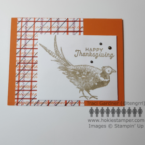 Thanksgiving card with a brown pheasant stamped on white and mounted over a plaid piece in shades of orange and maroon