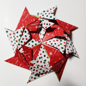 Folded Christmas paper in a round pattern.