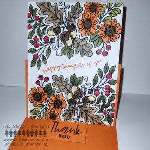 Fall card with large sprays of fall foliage, acorns, orange flowers and red berries across the top and bottom of the greeting card, with the sentiment Happy Thoughts of You across the middle. The card is propped up vertical as an easel, but the sentiment Thank You on the bumper.