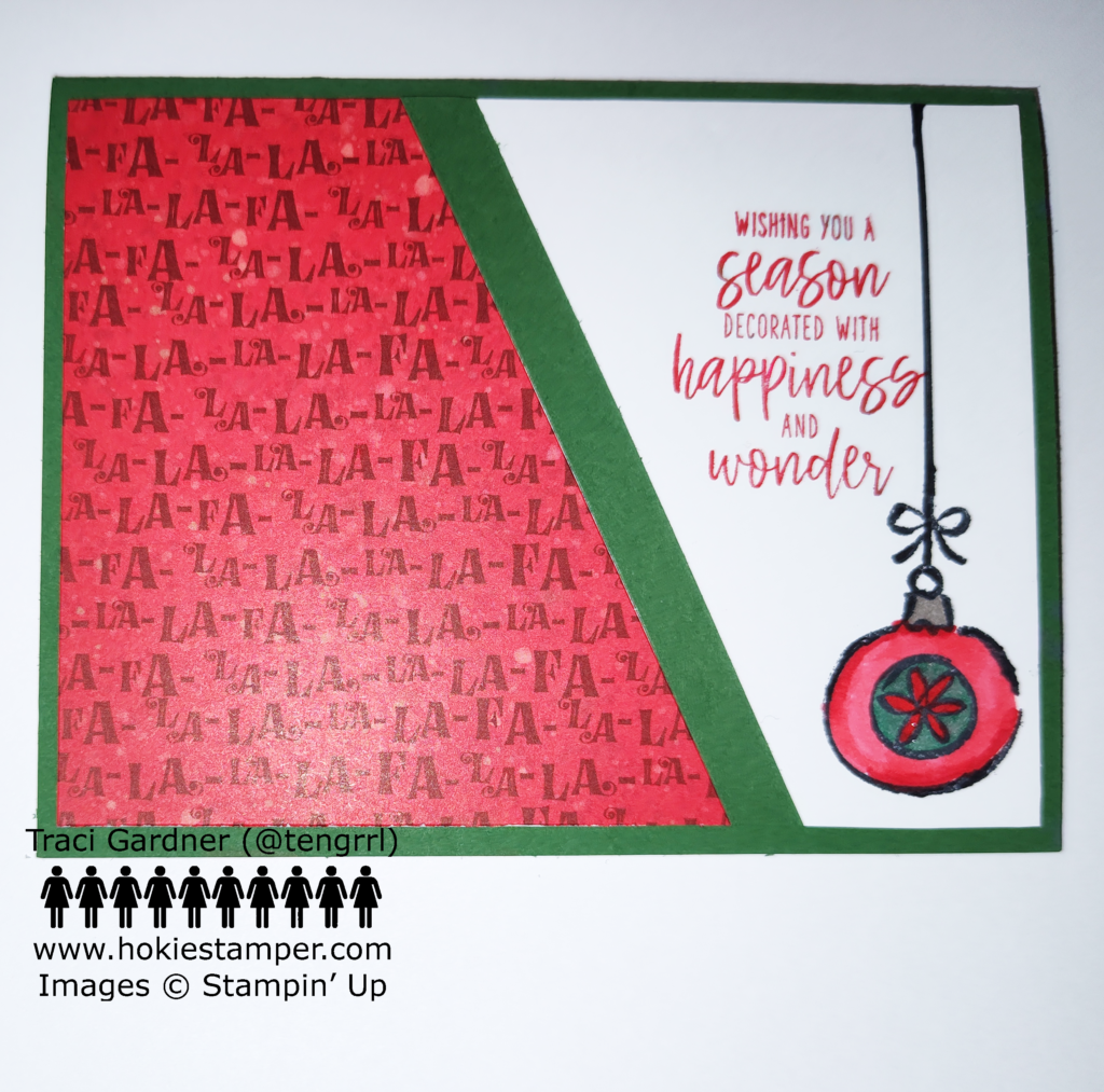 Garden Green Christmas card featuring a diagonal piece of red patterned paper with the words Fa La La La La on the left, and a white panel on the right with a dangling red and green ornament and the sentiment Wishing you a season decorated with happiness.