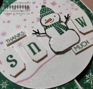 Detail on greeting card showing glittery snow in the focal image of a snowperson, with the sentiment Thanks SNOW much