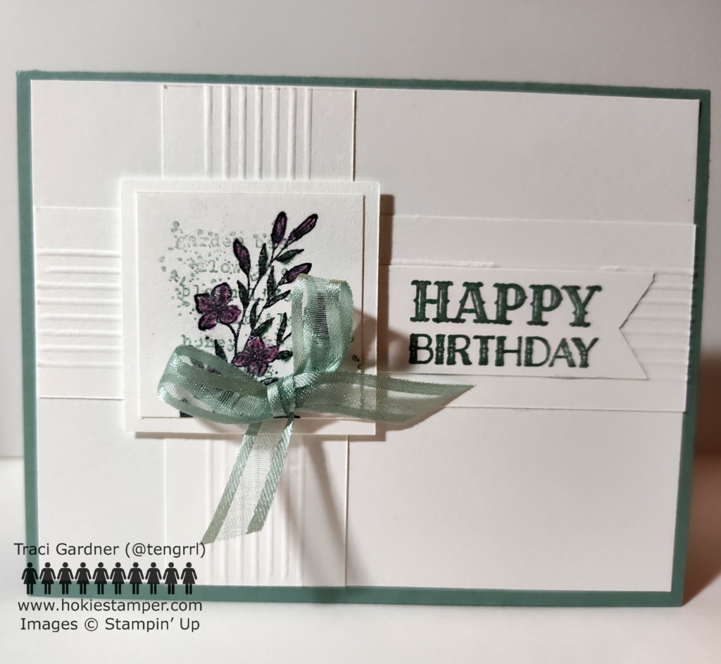 Simple birthday card with layers of white cardstock and a floral focal image, mounted on a soft green background