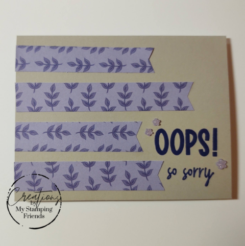 Card with stripes of purple paper showing darker purple leaves, with the sentiment, Oops. So Sorry.