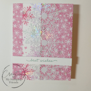 Greeting card with pink patterned paper covered with white snowflakes in the background. additional pink and iridescent snowflakes are also on the card, with the sentiment best wishes