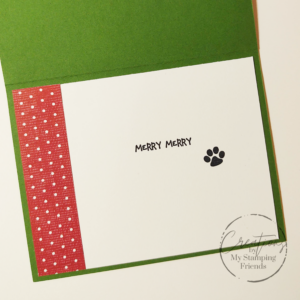 Inside of the card, showing the sentiment Merry Merry and a dog’s paw print.