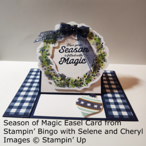Easel card with a holiday wreath in the center and a blue bow